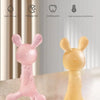 Pink and yellow silicone rabbit teether for babies shown with features like anti-gag size and soothing gums