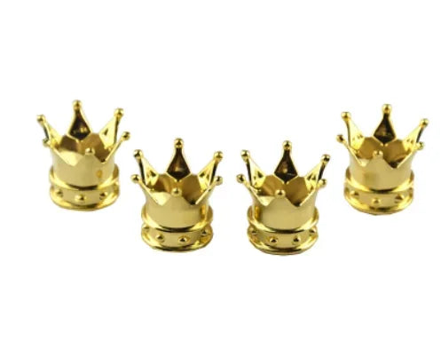 A set of four brass universal crown valve caps.