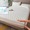 A white waterproof fitted mattress protector is shown being placed on a bed, with a close-up of the material texture and a bl