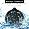 A black silicone cup holder coaster being washed under water with splashing blue water.