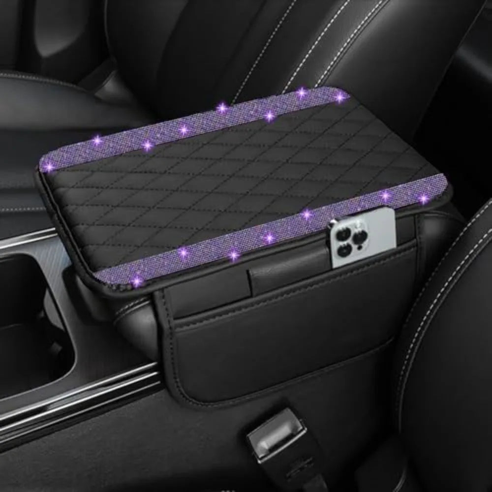 A black diamond quilted car armrest cover with purple glowing accents and a phone storage slot.