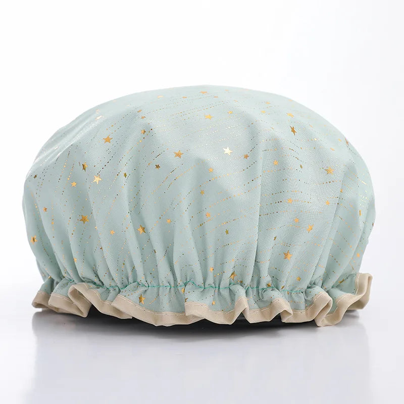 Light blue reusable elastic shower cap with gold star pattern