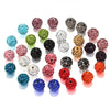 A collection of colorful crystal clay round beads in various shades including pink, green, blue, and black.