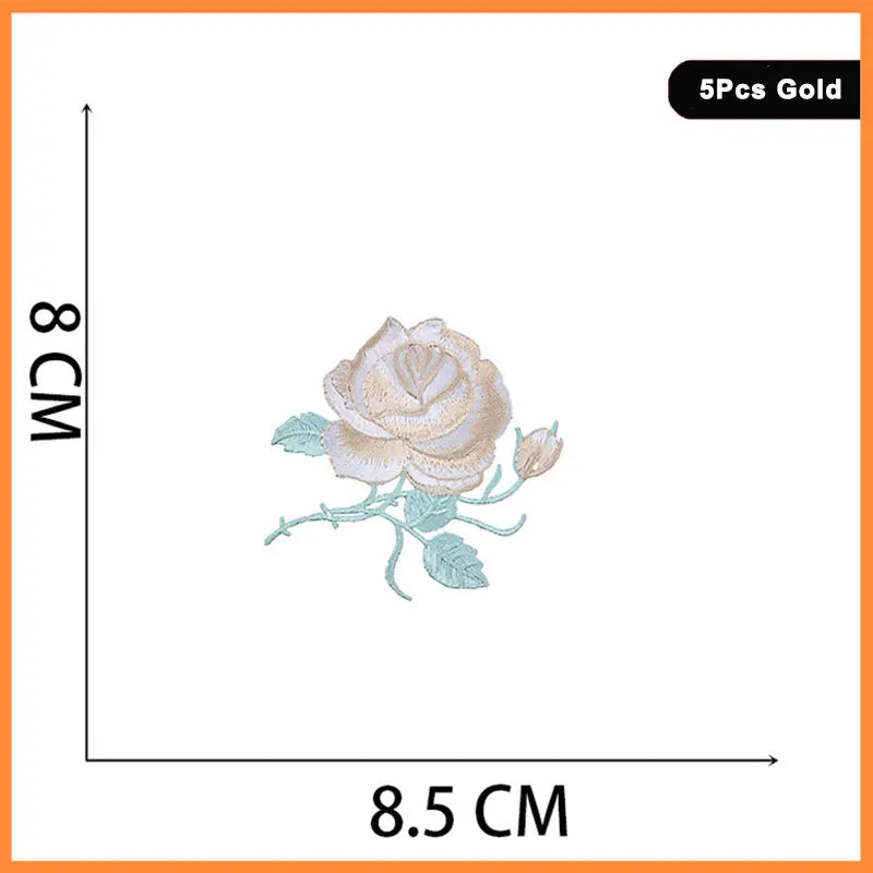 A close-up view of a light beige rose flower embroidery design on a white background.