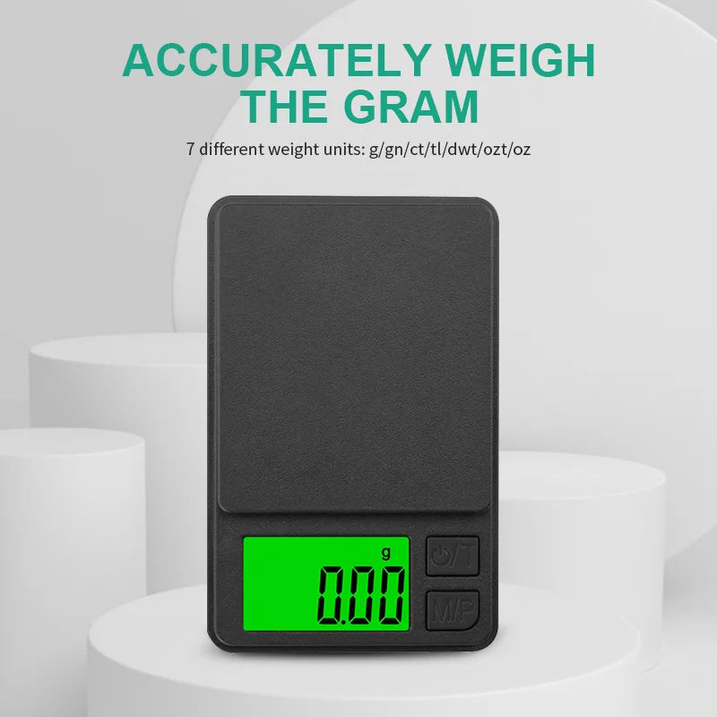 A black pocket digital scale with a bright green display showing 0.00 grams, resting on a white surface.