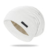 A white silk-like night cap is shown from above, folded and draped.