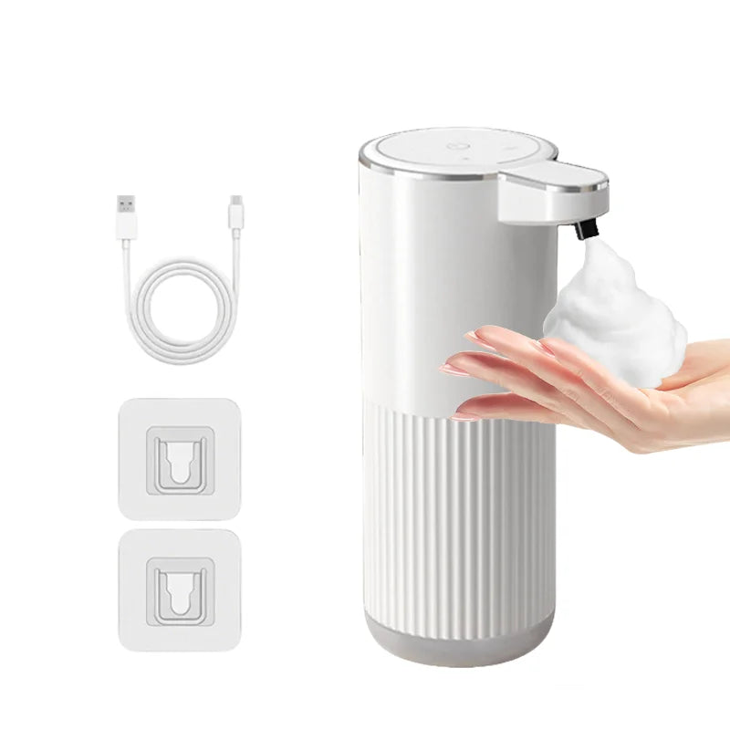 A white touchless automatic soap dispenser with a pump head and four foam control buttons is shown next to a hand dispensing 