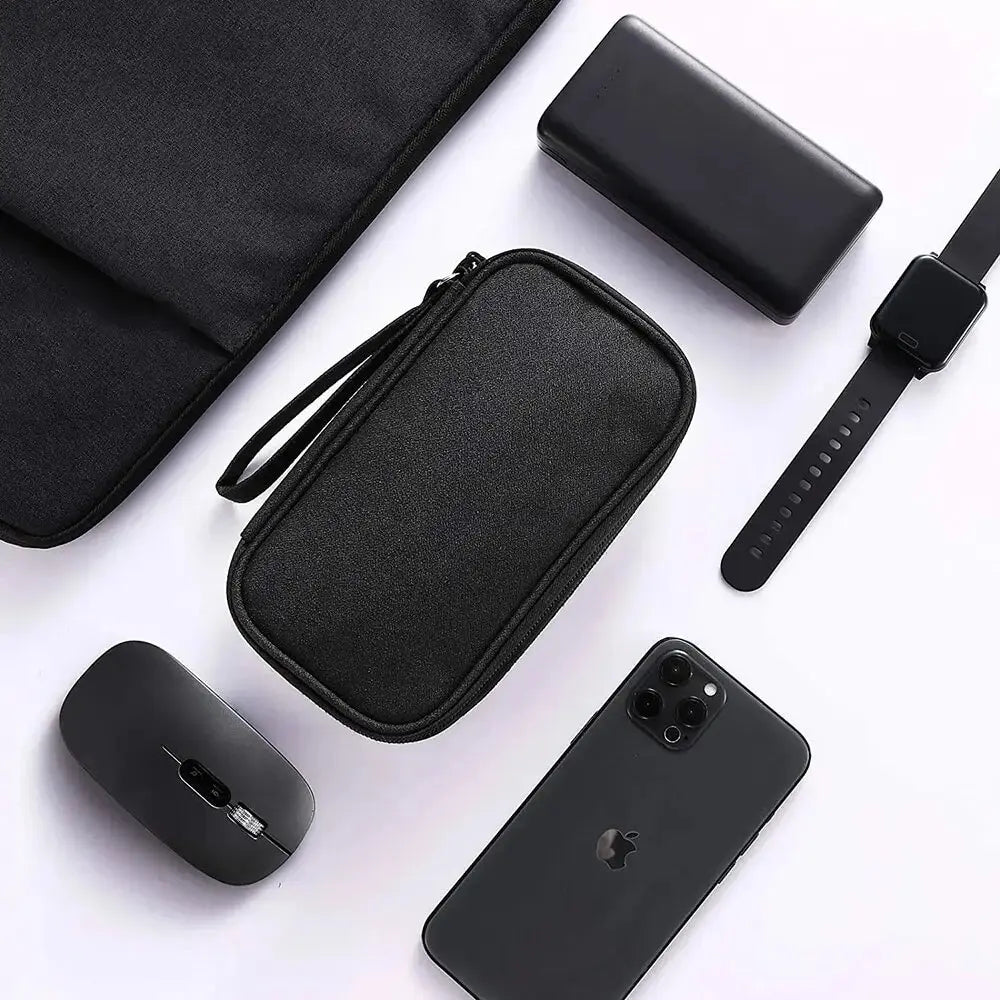 A black waterproof double-layer travel organizer for cables and accessories shown with a smartphone and a wrist strap.