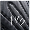 Close-up view of black full coverage PU leather car seat covers with visible stitching and texture.
