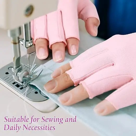 Pink fingerless compression gloves being used for sewing and daily necessities