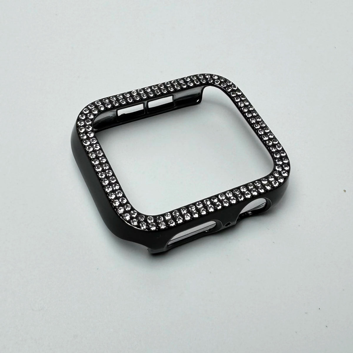 Carcasa de borde con lentejuelas negras para Apple Watch, mostrada sobre fondo blanco.