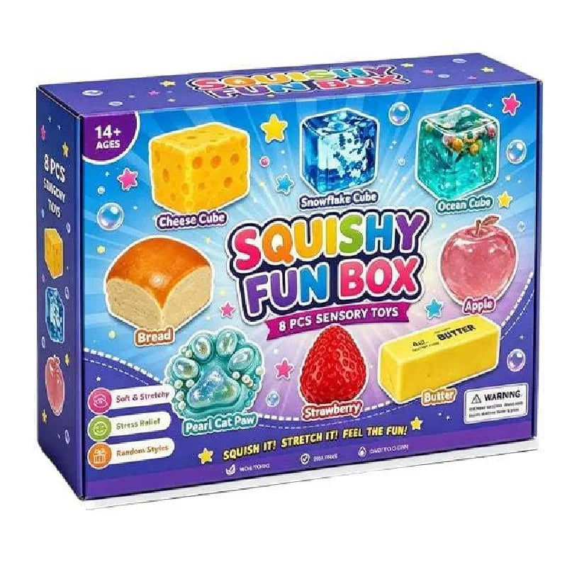 Eine Box mit Squishy Fun Box sensorischen Spielzeugen, darunter Käse-, Schneeflocken-, Ozean- und Apfelwürfel.