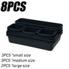 Black modular drawer organizer trays with interlocking dividers in small, medium, and large sizes.