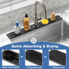 A stainless steel kitchen faucet with a black diatomite mat used for quick absorbing and drying.