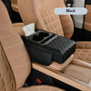 Black car center console armrest cushion with cup holder and storage pockets shown in a beige car interior.