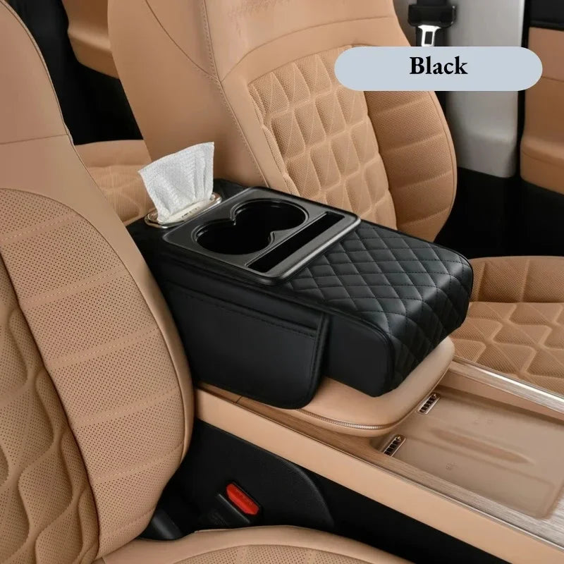 Black car center console armrest cushion with cup holder and storage pockets shown in a beige car interior.