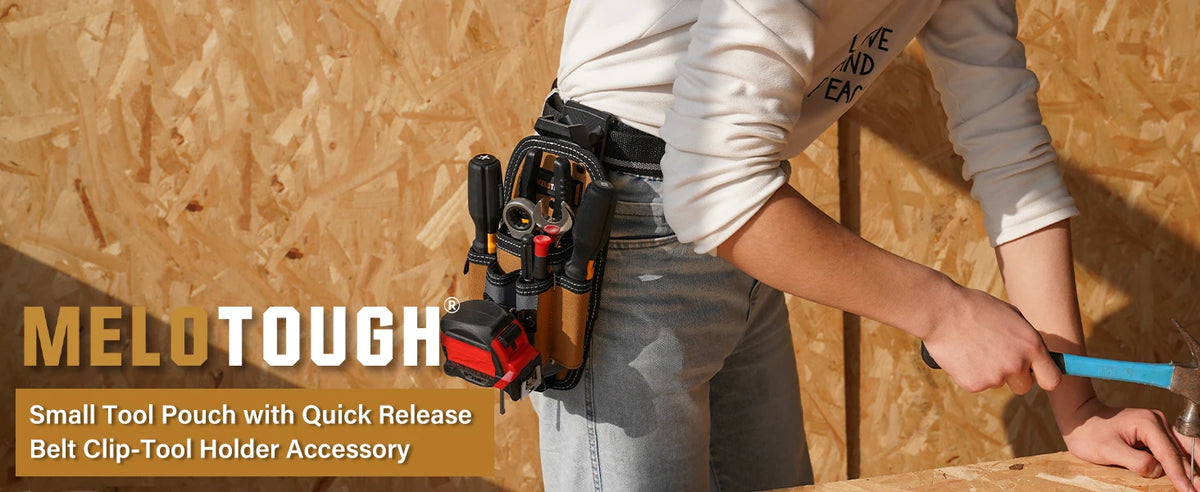 A person is holding a small tool pouch with a quick-release belt clip accessory.