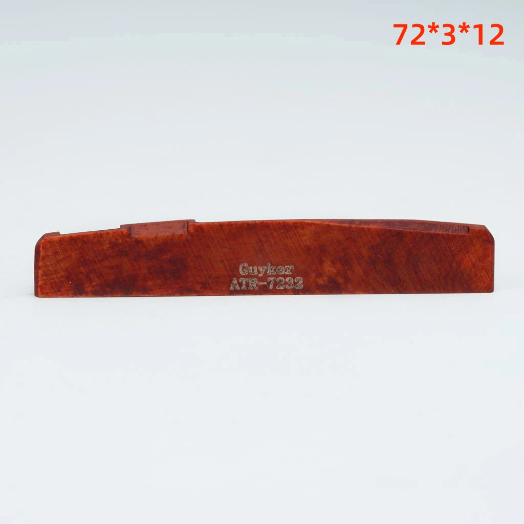 A wooden acoustic guitar bridge saddle with dimensions 72x3x12.