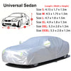 A white all-weather car cover draped over a sedan, showing its protective material.