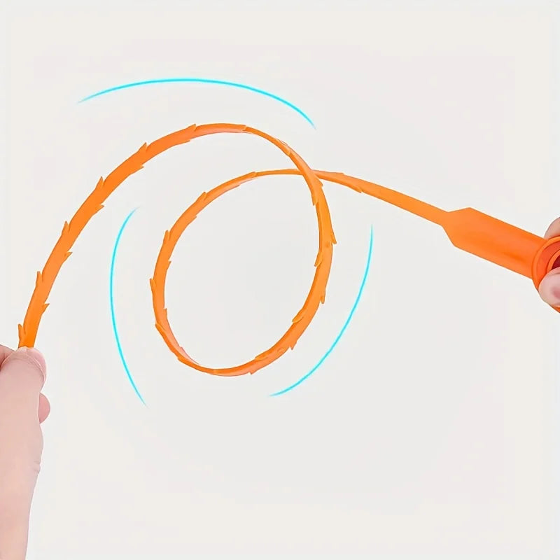 An orange flexible drain cleaning tool is shown twisting in the air against a light background.