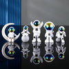 A collection of handcrafted astronaut figurine resin spacemen desk decor displayed on a dark surface.