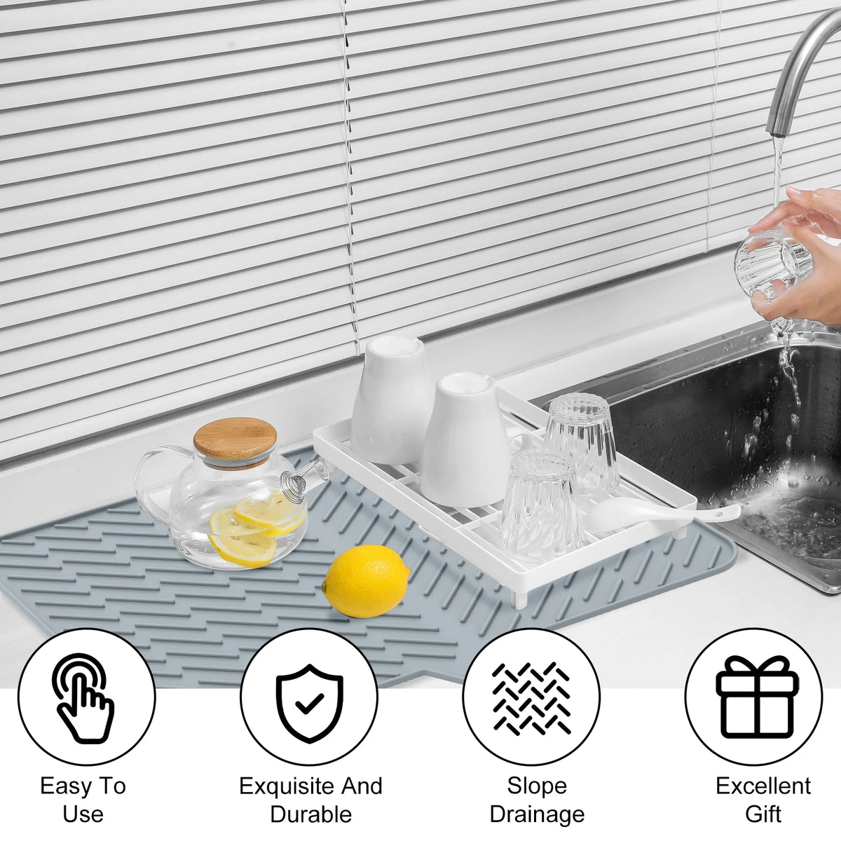 Silicone dish drying mat with drainage ramp placed under a kitchen sink