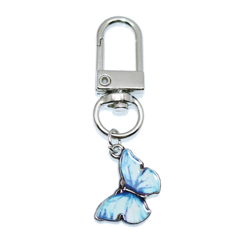 Silver padlock keychain charm with a light blue butterfly pendant