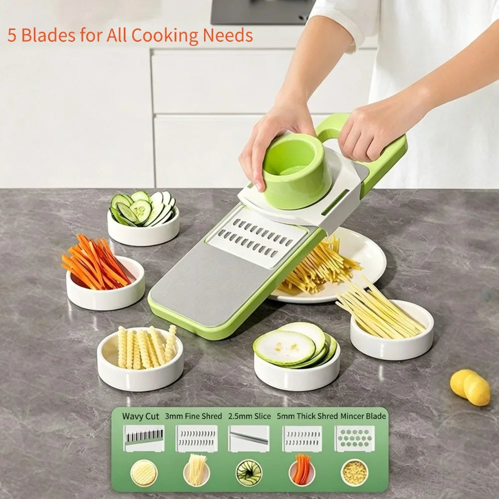 A hand is using a green vegetable cutter with five interchangeable blades to slice vegetables like cucumbers and carrots.