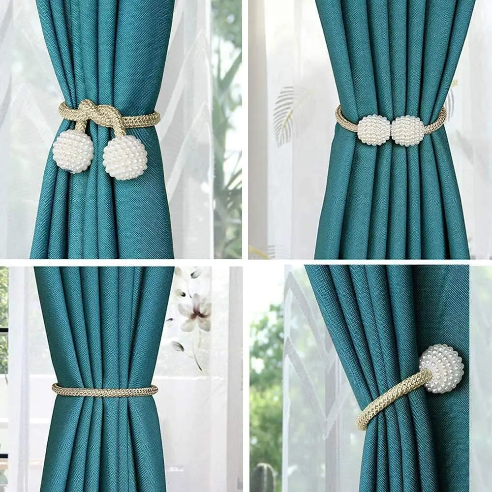 Elegant pearl magnetic curtain tie-back clips in gold and white for securing fabric.