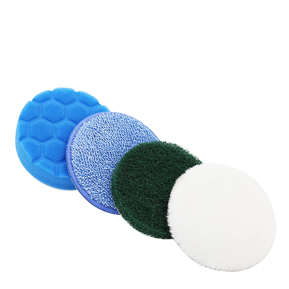 A set of four blue and green cleaning brush heads including a sponge, scouring pad, and polishing disc.