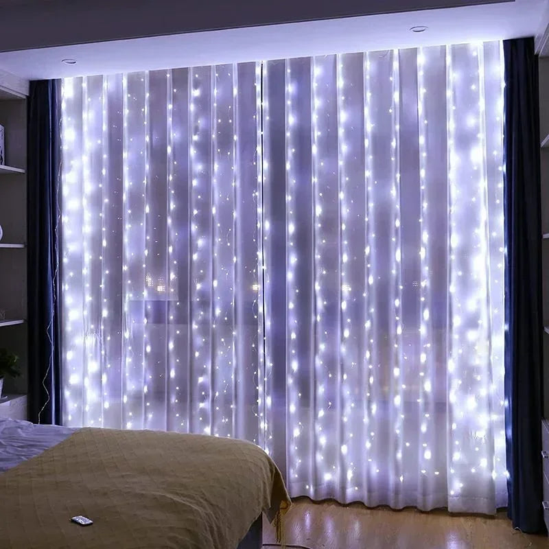 Sheer white LED curtain lights with twinkling fairy lights illuminating a window or room.
