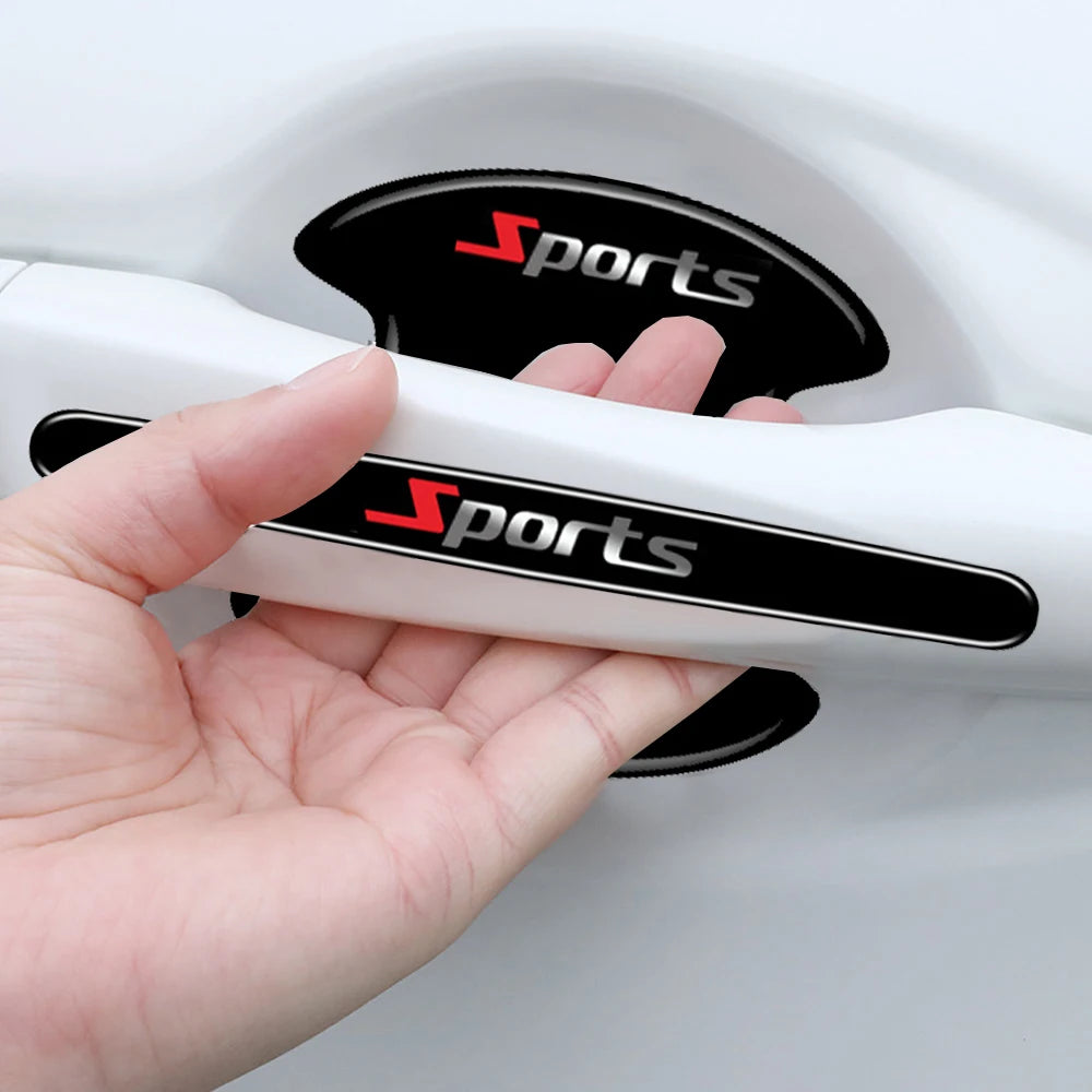 A hand holds a white car door handle with black grips and red sports lettering, demonstrating scratch-proof protective film.