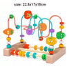 A wooden bead maze toy with colorful beads and strings arranged on a wooden base for toddlers.