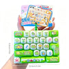 A green cartoon keycap fidget keychain with various animal and musical face designs is shown being held by a hand.