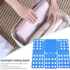 A hand is folding a pink garment inside a plastic board, demonstrating the automatic folding feature of a clothes folding boa