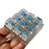 A clear plastic case holding multiple blue LED mechanical keychain fidget toys.