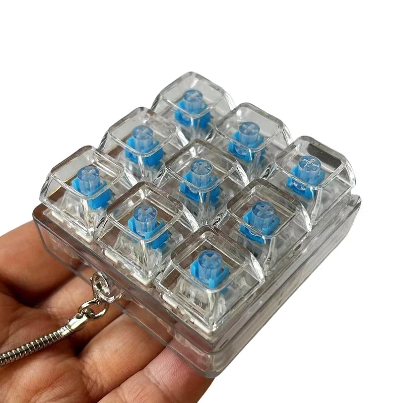 A clear plastic case holding multiple blue LED mechanical keychain fidget toys.
