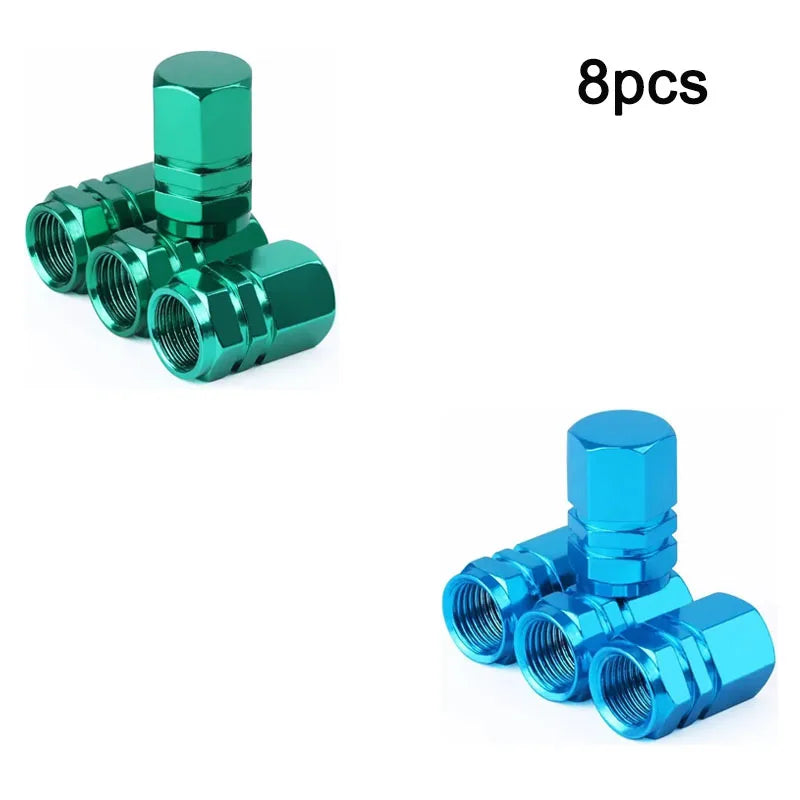 Eight aluminum alloy tire valve caps in various shades of green and blue.