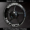 Matte silver and white reflective decals for a motorcycle wheel rim kit.