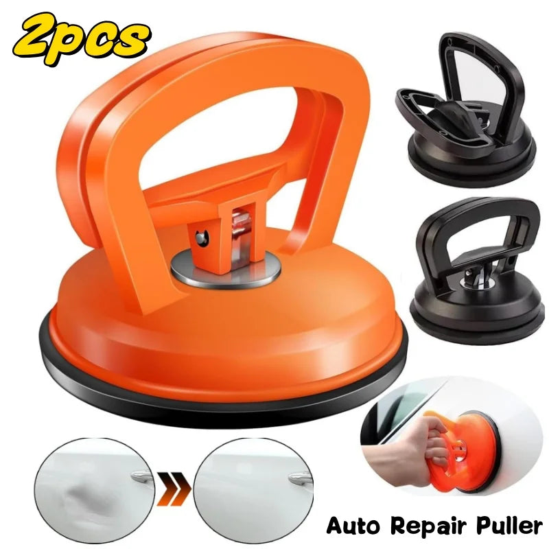 Orange heavy duty car dent puller kit with two suction cups and a handle for auto repair.