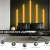 A decorative light strip featuring vertical orange LED lights illuminating a modern interior wall.