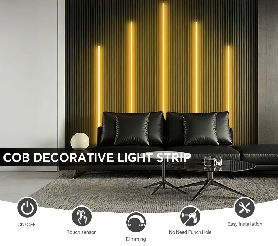 A decorative light strip featuring vertical orange LED lights illuminating a modern interior wall.