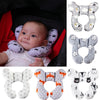 A set of soft, padded head and neck support pillows for a baby, shown in various colors and patterns.