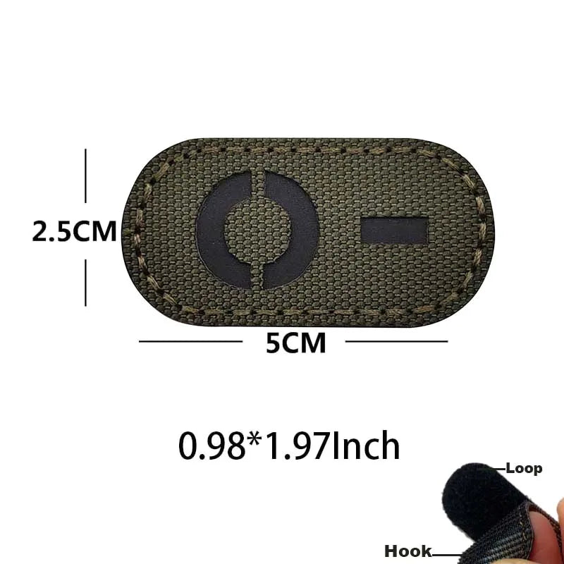 A rectangular dark green glow-in-the-dark tactical patch with a hook and loop backing.