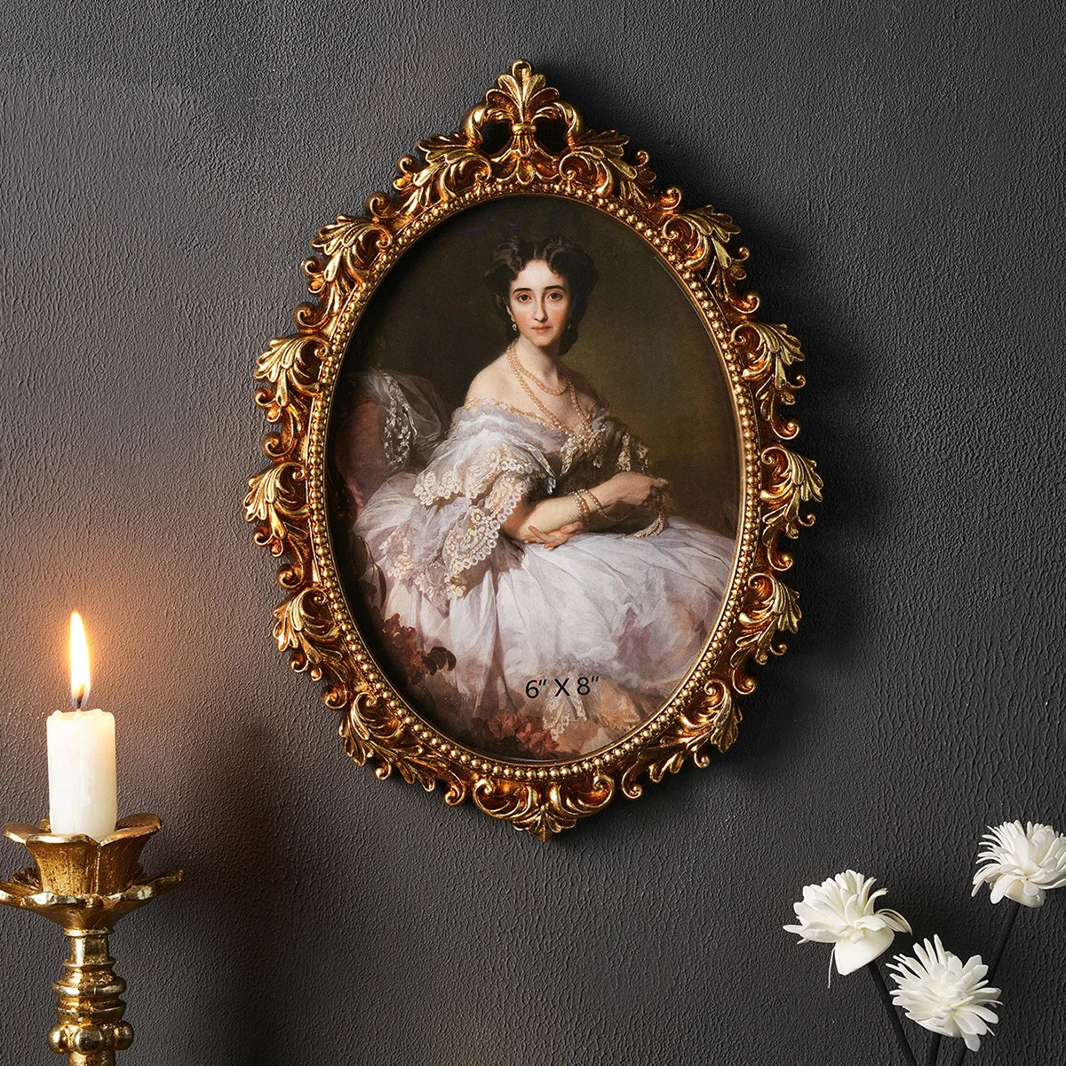 An ornate gold-framed oil painting featuring a woman in white lace dress against a dark background.