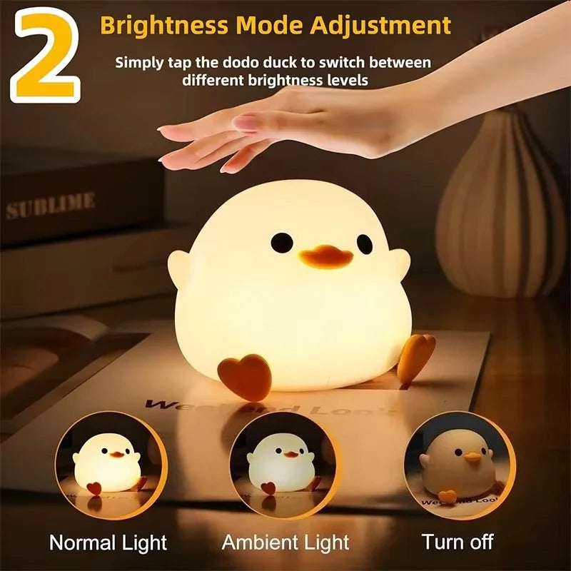 A white duck night light is shown with various brightness settings including normal, ambient, and turn off modes.
