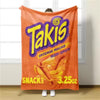A bright orange Takis snack bag hanging on a light-colored wall.