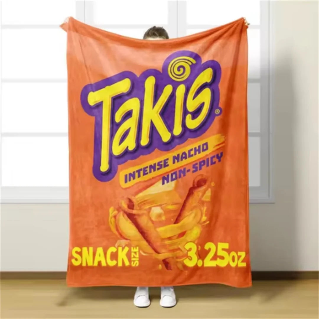 A bright orange Takis snack bag hanging on a light-colored wall.