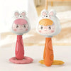 A pair of white and pink cartoon animal rattle toys for baby sensory development
