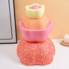 A stack of three colorful, textured balance stepping stones in pink, orange, and yellow.